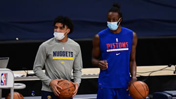 Feb 1, 2021; Denver, Colorado, USA;Detroit Pistons forward Jerami Grant (9) and Denver Nuggets guard Gary Harris (14) warm up before the game at Ball Arena. Mandatory Credit: Ron Chenoy-USA TODAY Sports