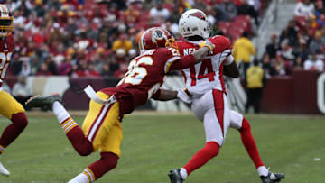 LANDOVER, MD - DECEMBER 17: Wide receiver J.J. Nelson #14 of the Arizona Cardinals is tackled by cornerback Bashaud Breeland #26 of the Washington Redskins at FedEx Field on December 17, 2017 in Landover, Maryland. (Photo by Rob Carr/Getty Images)