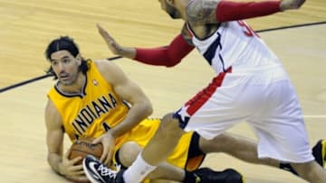 May 15, 2014; Washington, DC, USA; Indiana Pacers power forward Luis Scola (4) dives for a loose ball as Washington Wizards power forward Drew Gooden (90) looks on during the second half in game six of the second round of the 2014 NBA Playoffs at Verizon Center. The Pacers won 93-80. Mandatory Credit: Brad Mills-USA TODAY Sports