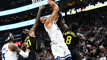 SALT LAKE CITY, UTAH - DECEMBER 09: Rudy Gobert #27 of the Minnesota Timberwolves attempts a rebound over Jordan Clarkson #00 and Jarred Vanderbilt #8 of the Utah Jazz during the first half of a game at Vivint Arena on December 09, 2022 in Salt Lake City, Utah. NOTE TO USER: User expressly acknowledges and agrees that, by downloading and or using this photograph, User is consenting to the terms and conditions of the Getty Images License Agreement. (Photo by Alex Goodlett/Getty Images)