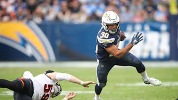 CARSON, CA - DECEMBER 09: Running back Austin Ekeler #30 of the Los Angeles Chargers makes a run play in front of outside linebacker Nick Vigil #59 of the Cincinnati Bengals in the third quarter at StubHub Center on December 9, 2018 in Carson, California. (Photo by Sean M. Haffey/Getty Images)