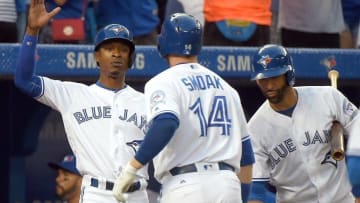 Aug 26, 2016; Toronto, Ontario, CAN; Toronto Blue Jays first baseman Justin Smoak (14) is greeted by left fielder Melvin Upton Jr. (7) and right fielder Jose Bautista (19) after hitting a three run home run against Minnesota Twins in the second inning at Rogers Centre. Mandatory Credit: Dan Hamilton-USA TODAY Sports