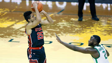 Feb 20, 2021; Eugene, Oregon, USA; Utah Utes guard Alfonso Plummer (25) shoots the ball over Oregon Ducks forward Eugene Omoruyi (2) during the first half at Matthew Knight Arena. Mandatory Credit: Soobum Im-USA TODAY Sports
