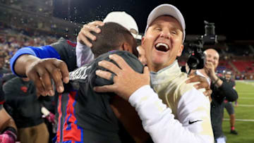 DALLAS, TX - OCTOBER 22: Head coach Chad Morris of the Southern Methodist Mustangs celebrates with Jackson Mitchell #44 of the Southern Methodist Mustangs after the Southern Methodist Mustangs beat the Houston Cougars 38-16 at Gerald J. Ford Stadium on October 22, 2016 in Dallas, Texas. (Photo by Tom Pennington/Getty Images)