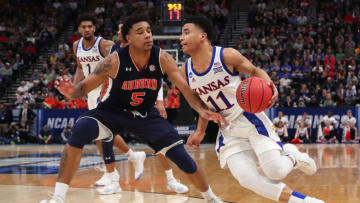 SALT LAKE CITY, UTAH - MARCH 23: Devon Dotson #11 of the Kansas Jayhawks drives with the ball against Chuma Okeke #5 of the Auburn Tigers during their game in the Second Round of the NCAA Basketball Tournament at Vivint Smart Home Arena on March 23, 2019 in Salt Lake City, Utah. (Photo by Tom Pennington/Getty Images)