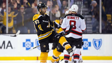 Oct 20, 2016; Boston, MA, USA; Boston Bruins center Patrice Bergeron (37) celebrates his winning goal as New Jersey Devils right wing Beau Bennett (8) skates away during the third period of the Boston Bruins 2-1 win over the New Jersey Devils at TD Garden. Mandatory Credit: Winslow Townson-USA TODAY Sports