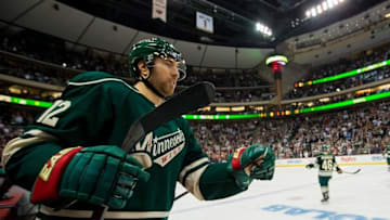 Mar 6, 2016; Saint Paul, MN, USA; Minnesota Wild forward David Jones (12) congratulates a teammate after a goal in the third period against the St. Louis Blues at Xcel Energy Center. The St. Louis Blues beat the Minnesota Wild 4-2. Mandatory Credit: Brad Rempel-USA TODAY Sports