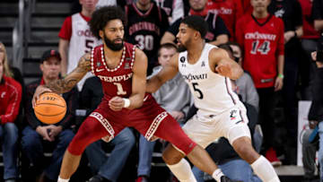 Cincinnati Bearcats guard David DeJulius defends Temple Owls guard Damian Dunn at Fifth Third Arena. Getty Images.