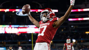 Dec 30, 2020; Arlington, TX, USA; Oklahoma Sooners wide receiver Marvin Mims (17) celebrates after scoring a touchdown against the Florida Gators in the first quarter at ATT Stadium. Mandatory Credit: Tim Heitman-USA TODAY Sports
