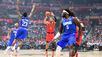 ATLANTA, GA - NOVEMBER 16: Trae Young #11 of the Atlanta Hawks shoots the ball against the LA Clippers on November 16, 2019 at State Farm Arena in Atlanta, Georgia. NOTE TO USER: User expressly acknowledges and agrees that, by downloading and/or using this Photograph, user is consenting to the terms and conditions of the Getty Images License Agreement. Mandatory Copyright Notice: Copyright 2019 NBAE (Photo by Scott Cunningham/NBAE via Getty Images)