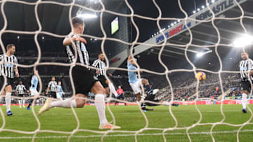 NEWCASTLE UPON TYNE, ENGLAND - JANUARY 29: Manchester City striker Sergio Aguero (c) shoots to score the opening goal during the Premier League match between Newcastle United and Manchester City at St. James Park on January 29, 2019 in Newcastle upon Tyne, United Kingdom. (Photo by Stu Forster/Getty Images)