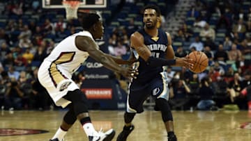 Mike Conley #11 of the Memphis Grizzlies works against Jrue Holiday #11 of the New Orleans Pelicans (Photo by Stacy Revere/Getty Images)