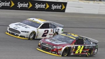 Nov 2, 2014; Fort Worth, TX, USA; NASCAR Sprint Cup Series driver Brad Keselowski (2) and NASCAR Sprint Cup Series driver Jeff Gordon (24) during the AAA Texas 500 at Texas Motor Speedway. Mandatory Credit: Jasen Vinlove-USA TODAY Sports