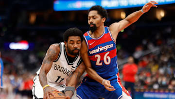 Jan 19, 2022; Washington, District of Columbia, USA; Brooklyn Nets guard Kyrie Irving (11) dribbles the ball as Washington Wizards guard Spencer Dinwiddie (26) defends during the second quarter at Capital One Arena. Mandatory Credit: Geoff Burke-USA TODAY Sports