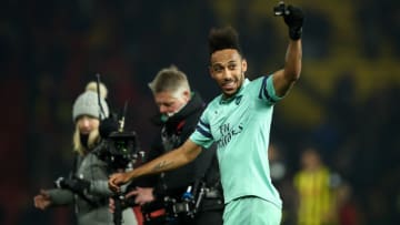 WATFORD, ENGLAND - APRIL 15: Pierre-Emerick Aubameyang of Arsenal celebrates towards the traveling fans following his side's victory during the Premier League match between Watford FC and Arsenal FC at Vicarage Road on April 15, 2019 in Watford, United Kingdom. (Photo by Marc Atkins/Getty Images)