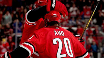 RALEIGH, NC - DECEMBER 27: Sebastian Aho #20 of the Carolina Hurricanes celebrates after scoring a goal during an NHL game against the Montreal Canadiens on December 27, 2017 at PNC Arena in Raleigh, North Carolina. (Photo by Gregg Forwerck/NHLI via Getty Images)