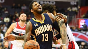 Dec 28, 2016; Washington, DC, USA; Washington Wizards forward Kelly Oubre Jr. (12) fouls Indiana Pacers forward Paul George (13) during the first half at Verizon Center. Mandatory Credit: Brad Mills-USA TODAY Sports