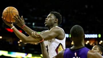 Apr 10, 2015; New Orleans, LA, USA; New Orleans Pelicans guard Jrue Holiday (11) shoots the ball over Phoenix Suns forward Earl Barron (30) during the second half of a game at the Smoothie King Center. The Pelicans defeated the Sun 90-75. Mandatory Credit: Derick E. Hingle-USA TODAY Sports