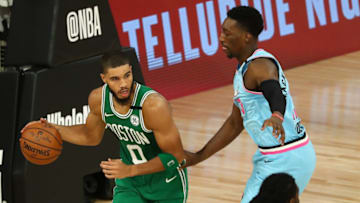 Former Duke basketball standout Jayson Tatum is guarded by Bam Adebayo. (Photo by Kim Klement - Pool/Getty Images)