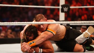 NEW YORK, NY - AUGUST 23: Seth Rollins and John Cena battle it out at the WWE SummerSlam 2015 at Barclays Center of Brooklyn on August 23, 2015 in New York City. (Photo by JP Yim/Getty Images)