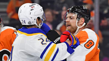 Apr 17, 2022; Philadelphia, Pennsylvania, USA; Buffalo Sabres center Dylan Cozens (24) and Philadelphia Flyers defenseman Kevin Connauton (8) battle during the third period at Wells Fargo Center. Mandatory Credit: Eric Hartline-USA TODAY Sports
