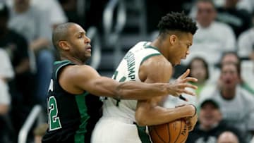 MILWAUKEE, WISCONSIN - APRIL 28: Giannis Antetokounmpo #34 of the Milwaukee Bucks dribbles the ball while being guarded by Al Horford #42 of the Boston Celtics in the first quarter during Game One of Round Two of the 2019 NBA Playoffs at the Fiserv Forum on April 28, 2019 in Milwaukee, Wisconsin. NOTE TO USER: User expressly acknowledges and agrees that, by downloading and or using this photograph, User is consenting to the terms and conditions of the Getty Images License Agreement. (Photo by Dylan Buell/Getty Images)