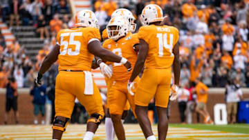 KNOXVILLE, TN - OCTOBER 12: Tim Jordan #9 of the Tennessee Volunteers celebrates with Brandon Kennedy #55 and Jerrod Means #14 after rushing for a fifteen yard touchdown during the first half of a game against the Mississippi State Bulldogs at Neyland Stadium on October 12, 2019 in Knoxville, Tennessee. (Photo by Carmen Mandato/Getty Images)
