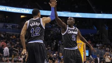 Jan 24, 2014; Orlando, FL, USA; Orlando Magic small forward Tobias Harris (12) and shooting guard Victor Oladipo (5) high five against the Los Angeles Lakers during the second half at Amway Center. Orlando Magic won 114-105. Mandatory Credit: Kim Klement-USA TODAY Sports