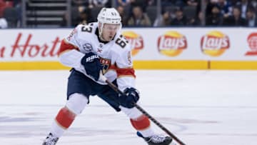 TORONTO, ON - MARCH 25: Florida Panthers Right Wing Evgenii Dadonov (63) skates with the puck during the NHL regular season game between the Florida Panthers and the Toronto Maple Leafs on March 25, 2019, at Scotiabank Arena in Toronto, ON, Canada. (Photo by Julian Avram/Icon Sportswire via Getty Images)