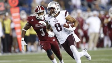 Sep 24, 2016; Foxborough, MA, USA; Mississippi State Bulldogs wide receiver Fred Ross (8) evades Massachusetts Minutemen safety Lee Moses (3) during the fourth quarter at Gillette Stadium. Mississippi State won 47-35. Credit: Greg M. Cooper-USA TODAY Sports