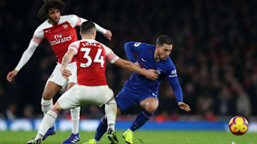 LONDON, ENGLAND - JANUARY 19: Eden Hazard of Chelsea is challenged by Granit Xhaka and Mohamed Elneny of Arsenal during the Premier League match between Arsenal FC and Chelsea FC at Emirates Stadium on January 19, 2019 in London, United Kingdom. (Photo by Catherine Ivill/Getty Images)