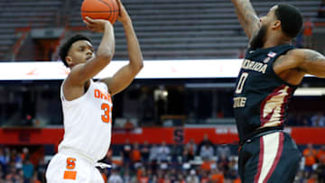 SYRACUSE, NY - FEBRUARY 05: Elijah Hughes #33 of the Syracuse Orange shoots the ball as Phil Cofer #0 of the Florida State Seminoles defends during the first half at the Carrier Dome on February 5, 2019 in Syracuse, New York. (Photo by Rich Barnes/Getty Images)