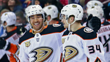 VANCOUVER, BC - MARCH 26: Sam Steel #34 of the Anaheim Ducks is congratulated by teammate Kiefer Sherwood #64 after scoring during their NHL game against the Vancouver Canucks at Rogers Arena March 26, 2019 in Vancouver, British Columbia, Canada. (Photo by Jeff Vinnick/NHLI via Getty Images)