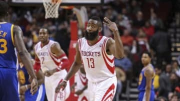 Dec 6, 2013; Houston, TX, USA; Houston Rockets shooting guard James Harden (13) reacts after making a basket during the fourth quarter against the Golden State Warriors at Toyota Center. The Rockets defeated the Warriors 105-83. Mandatory Credit: Troy Taormina-USA TODAY Sports