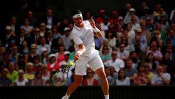 LONDON, ENGLAND - JULY 12: Milos Raonic of Canada plays a forehand during the Gentlemen's Singles quarter final match against Roger Federer of Switzerland on day nine of the Wimbledon Lawn Tennis Championships at the All England Lawn Tennis and Croquet Club on July 12, 2017 in London, England. (Photo by Clive Brunskill/Getty Images)