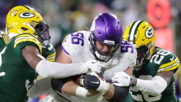 Minnesota Vikings center Garrett Bradbury (56) is tackled by Green Bay Packers safety Adrian Amos (31) and free safety Darnell Savage (26) after scooping up a fumble on Sunday, January 2, 2022, at Lambeau Field in Green Bay, Wis. Wm. Glasheen USA TODAY NETWORK-WisconsinApc Packers Vs Vikings 27833 010222wag