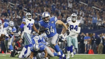 Dec 26, 2016; Arlington, TX, USA; Detroit Lions fullback Zach Zenner (34) scores a touchdown against the Dallas Cowboys in the first quarter at AT&T Stadium. Mandatory Credit: Tim Heitman-USA TODAY Sports