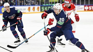USA's forward Carter Mazur (L), USA's defender Lane Hutson (C) and Denmark's forward Morten Poulsen vie during the IIHF Ice Hockey Men's World Championships Preliminary Round - Group A match between USA and Denmark in Tampere, Finland, on May 20, 2023. (Photo by Vesa Moilanen / Lehtikuva / AFP) / Finland OUT (Photo by VESA MOILANEN/Lehtikuva/AFP via Getty Images)