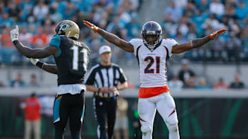 Dec 4, 2016; Jacksonville, FL, USA; Denver Broncos cornerback Aqib Talib (21) and Jacksonville Jaguars wide receiver Marqise Lee (11) during the second half of an NFL football game at EverBank Field. The Broncos won 20-10. Mandatory Credit: Reinhold Matay-USA TODAY Sports