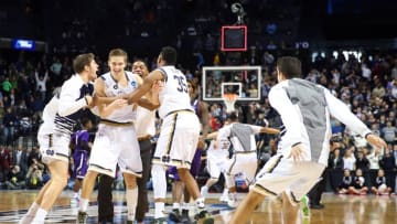 Mar 20, 2016; Brooklyn, NY, USA; Notre Dame Fighting Irish guard Rex Pflueger (second from left) celebrates with his teammates as time expires after tipping in the winning basket against the Stephen F. Austin Lumberjacks in the second round of the 2016 NCAA Tournament at Barclays Center. Mandatory Credit: Anthony Gruppuso-USA TODAY Sports