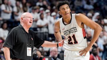 Westminster coach Ronnie Stapler talks with Chase McCarty (21) during the AHSAA 4A boys state basketball championship game at Legacy Arena in Birmingham, Ala., on Friday March 3, 2023.J07