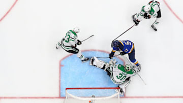 ST. LOUIS, MO - MAY 3: Ben Lovejoy #21, Esa Lindell #23 and Ben Bishop of the Dallas Stars defend the goal against David Perron #57 of the St. Louis Blues in Game Three of the Western Conference Second Round during the 2019 NHL Stanley Cup Playoffs at the Enterprise Center on May 3, 2019 in St. Louis, Missouri. (Photo by Dilip Vishwanat/Getty Images)