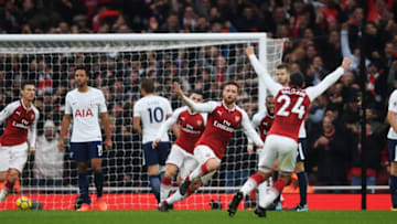 LONDON, ENGLAND - NOVEMBER 18: Shkodran Mustafi of Arsenal celebrates with team mates after scoring his sides first goal during the Premier League match between Arsenal and Tottenham Hotspur at Emirates Stadium on November 18, 2017 in London, England. (Photo by Mike Hewitt/Getty Images)