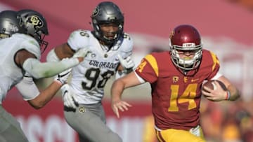 Oct 8, 2016; Los Angeles, CA, USA; USC Trojans quarterback Sam Darnold (14) carries the ball against the Colorado Buffaloes during a NCAA football game at Los Angeles Memorial Coliseum. USC defeated Colorado 21-17. Mandatory Credit: Kirby Lee-USA TODAY Sports