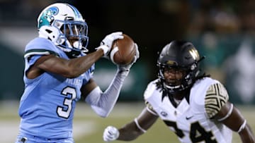 NEW ORLEANS, LA - AUGUST 30: Darnell Mooney #3 of the Tulane Green Wave catches the ball as Ja'Sir Taylor #24 of the Wake Forest Demon Deacons defends during the second half on August 30, 2018 in New Orleans, Louisiana. (Photo by Jonathan Bachman/Getty Images)