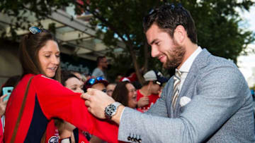 WASHINGTON, DC - OCTOBER 07: Tom Wilson #43 of the Washington Capitals signs autographs for fans on the Rock the Red Carpet prior to the start of a game against the Montreal Canadiens at Capital One Arena on October 7, 2017 in Washington, DC. (Photo by Patrick McDermott/NHLI via Getty Images)