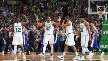 BOSTON, MA - May 3: Al Horford #42 of the Boston Celtics exchanges high fives with Terry Rozier #12 and Marcus Morris #13 against the Philadelphia 76ers in Game Two of Round Two of the 2018 NBA Playoffs on May 3, 2018 at the TD Garden in Boston, Massachusetts. NOTE TO USER: User expressly acknowledges and agrees that, by downloading and or using this photograph, User is consenting to the terms and conditions of the Getty Images License Agreement. Mandatory Copyright Notice: Copyright 2018 NBAE (Photo by Brian Babineau/NBAE via Getty Images)