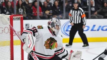 November 29, 2014; Los Angeles, CA, USA; Chicago Blackhawks goalie Corey Crawford (50) blocks a shot against the Los Angeles Kings during the third period at Staples Center. Mandatory Credit: Gary A. Vasquez-USA TODAY Sports