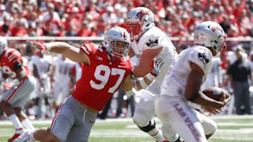 Ohio State Buckeyes defensive lineman Nick Bosa (97) chases down UNLV Rebels quarterback Armani Rogers (1) under pressure from UNLV Rebels offensive lineman Kyle Saxelid, center, during the second quarter of a NCAA college football game between the Ohio State Buckeyes and the UNLV Rebels on Saturday, September 23, 2017 at Ohio Stadium in Columbus, Ohio. [Joshua A. Bickel/Dispatch]1013108925 Oh Col Osufb