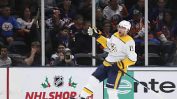 UNIONDALE, NEW YORK - DECEMBER 17: Craig Smith #15 of the Nashville Predators celebrates his goal against the New York Islanders at NYCB Live's Nassau Coliseum on December 17, 2019 in Uniondale, New York. The Predators defeated the Islanders 8-3. (Photo by Bruce Bennett/Getty Images)